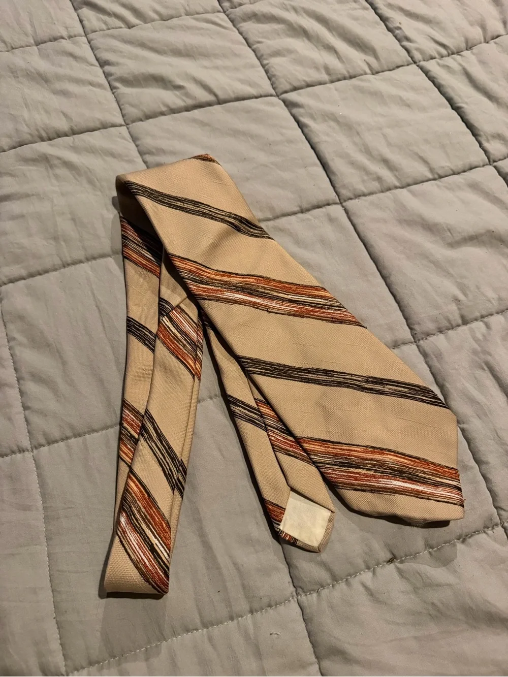 Beige Men's Striped Necktie with Orange and Brown Accents